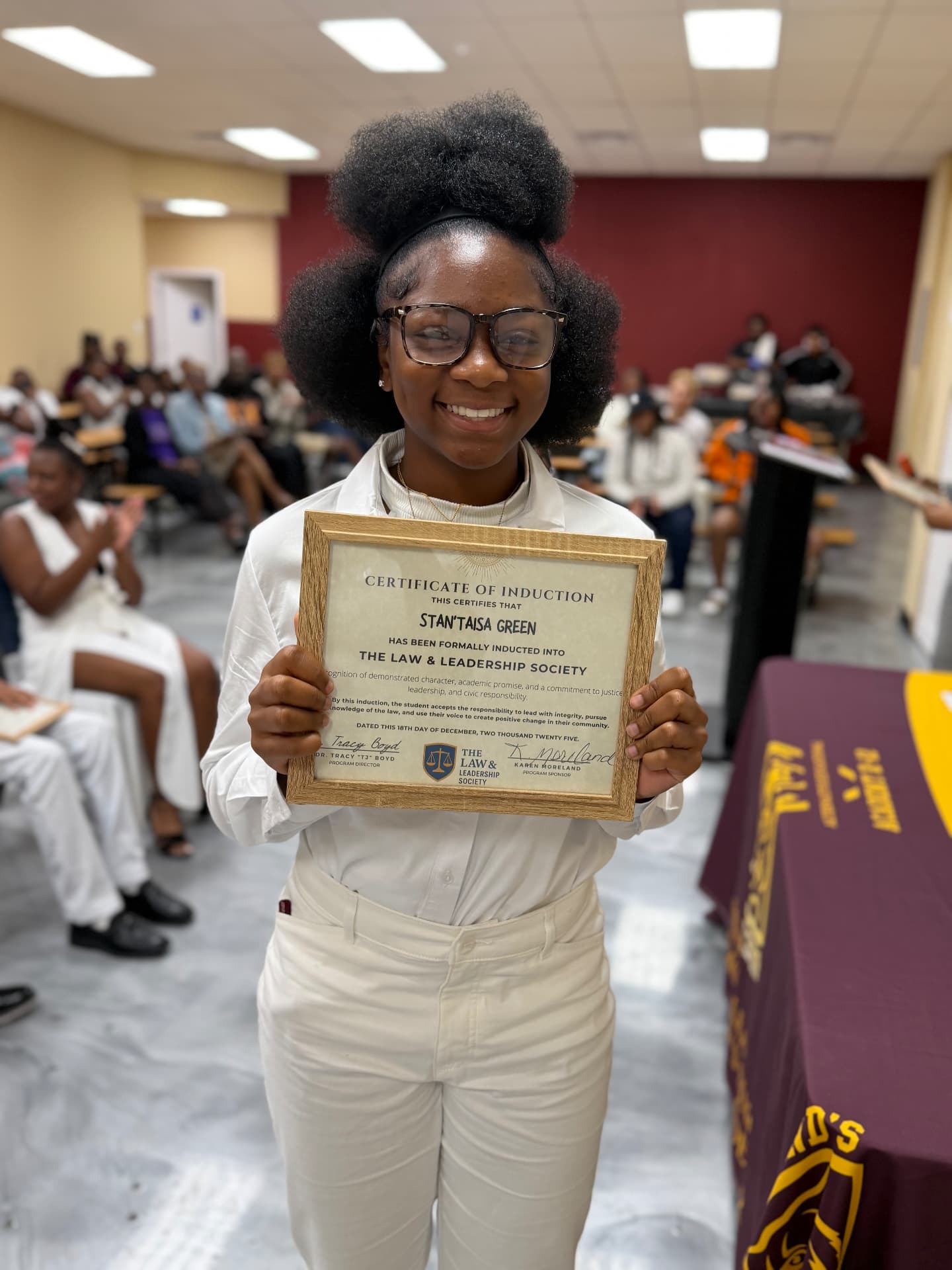 An LLS student celebrating Law and Leadership Society induction
